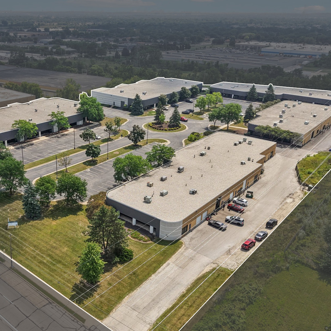 Aerial view of a multi-building industrial park with surface parking and landscaped grounds in Milwaukee