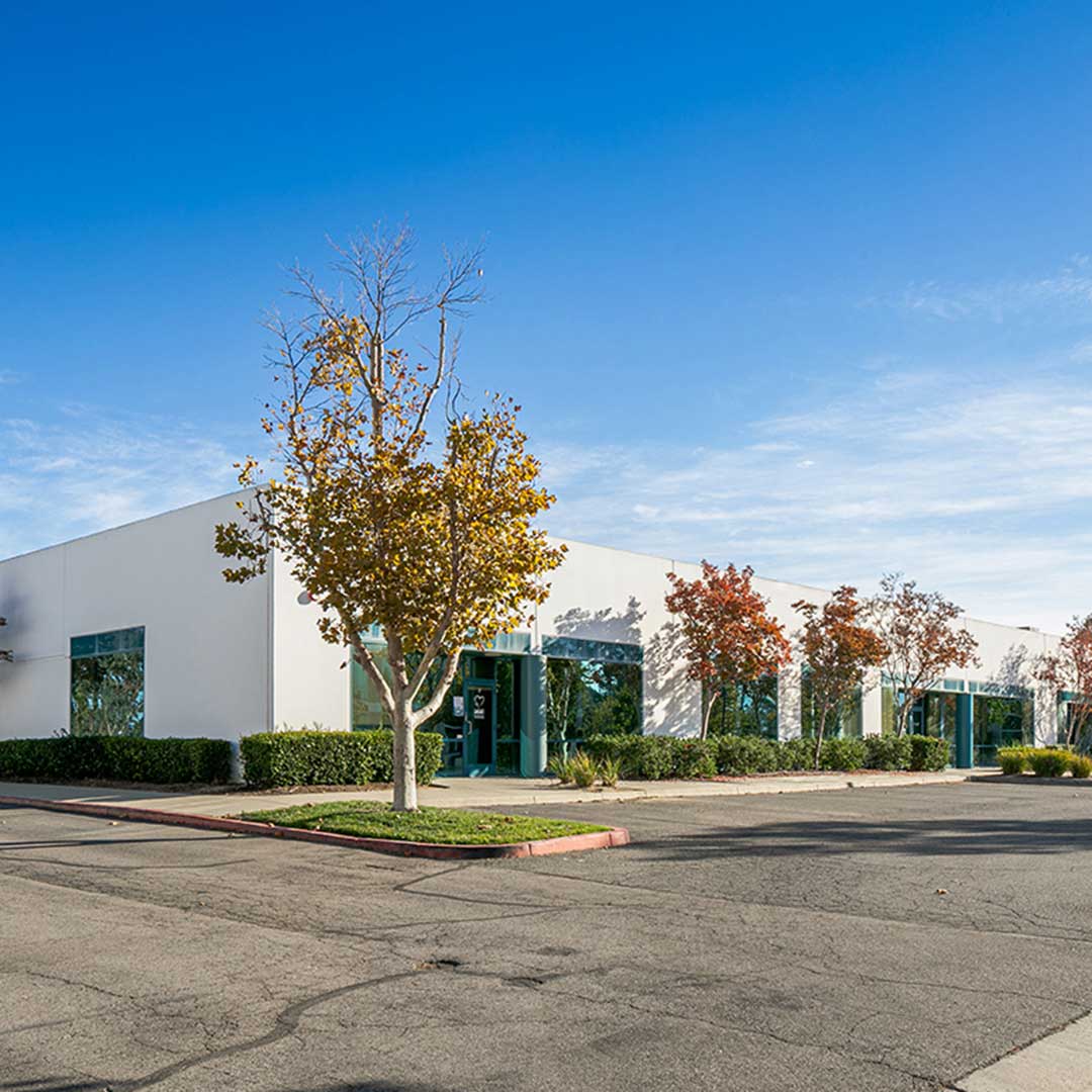 Multi-unit flex industrial buildings at 40880-40945 County Center Drive Temecula CA with storefront glass, parking lot, and landscaped tree islands