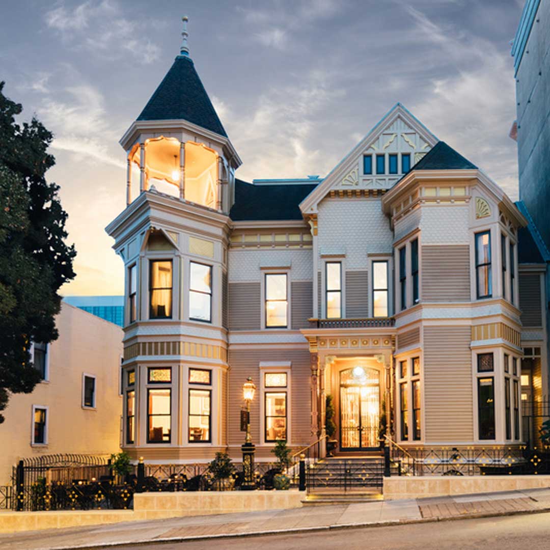 Ornate architectural design with a turret, bay windows, and decorative trim