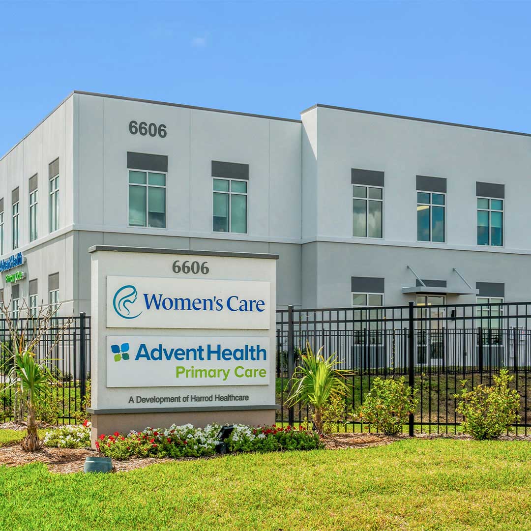 Modern medical office building with Women’s Care and AdventHealth Primary Care signage, showcasing a clean, landscaped healthcare property exterior for lease or investment