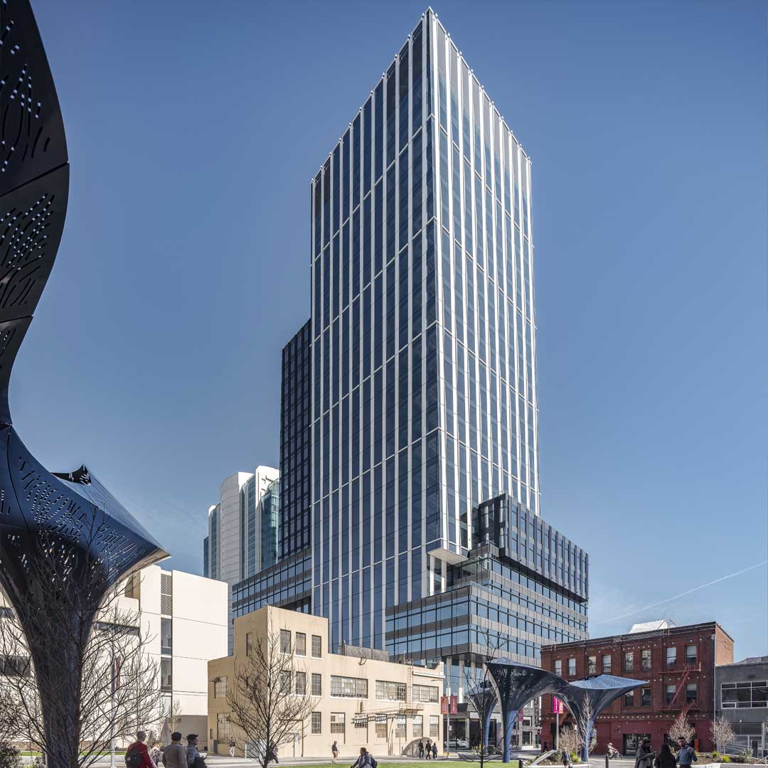 A multi-story podium base with retail or lobby frontage