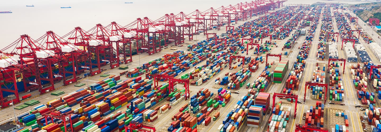 Shipping containers lined up at port