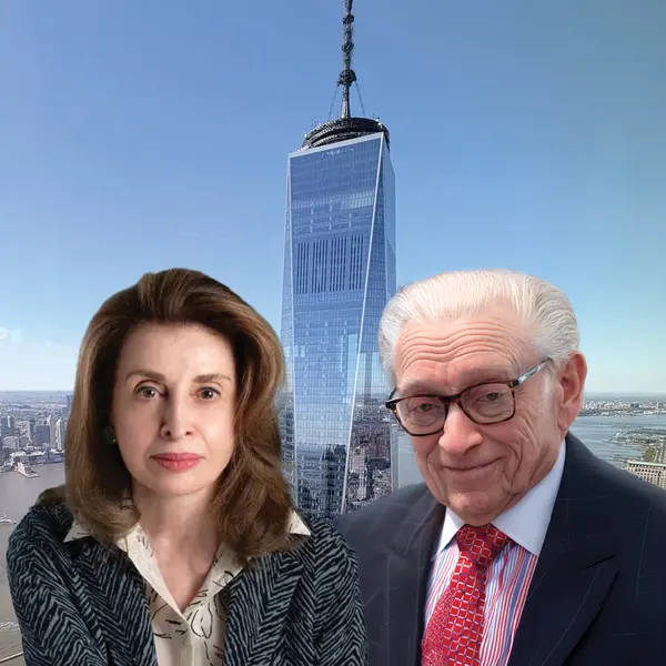 Two people standing in the foreground of a city skyline